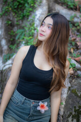 Obraz premium Beautiful Asian woman model in a casual style with a vacation background