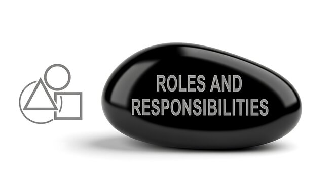Polished black stone inscribed with text emphasizing organizational roles and associated duties rests beside abstract geometric shapes.
