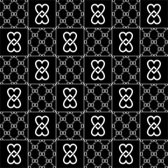 Seamless black and white geometric pattern with heart-shaped monogram motifs, luxury ornamental repeat background for fashion, textile, wallpaper and surface design.