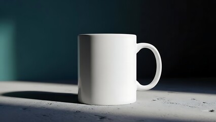A white coffee mug on a gray surface with a dark background and dramatic lighting