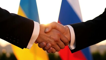 business handshake of russia and ukraine representatives with waving flags at sunset representing peace efforts and ceasefire search