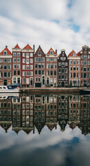 Fototapeta premium Amsterdam Canal Houses Reflections Water Architecture Netherlands Urban Scene Cityscape Travel Destination Tourism