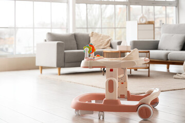 Baby walker on floor in living room