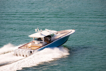 Luxury Fishing Motor Yacht With Five Outboard Engine Cruising at High Speed