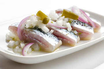 Gourmet Studio Shot of Hollandse Nieuwe Raw Herring with Onions and Pickles Beautifully Arranged