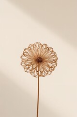Flower made of wire is sitting on a white background