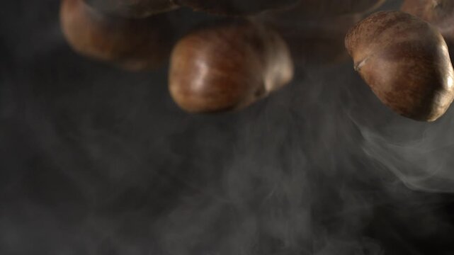Super slow motion Cozy roasted chestnut environment, Atmospheric street roast with steaming chestnuts in warm