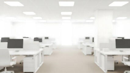 Blurred office space with white desks and computers