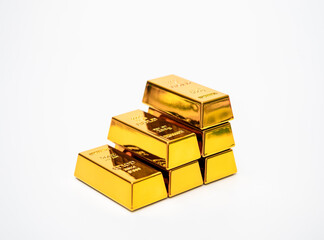 Stacked gold bars arranged like growing chart isolated on white background. Rising gold prices, financial growth, wealth, and investment. Ideal for economic content, trading, and global market trends.