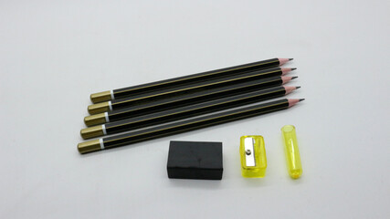 Black wooden pencil with sharpener on white background