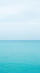 Fototapeta premium Calm Ocean Horizon Turquoise Blue Water Serene Seascape Coastline Tranquil Natural Scenery Peaceful Ripple Surface Sky Relaxation Background