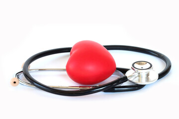 Doctor&rsquo;s stethoscope forming a red heart shape, isolated on clean white background.