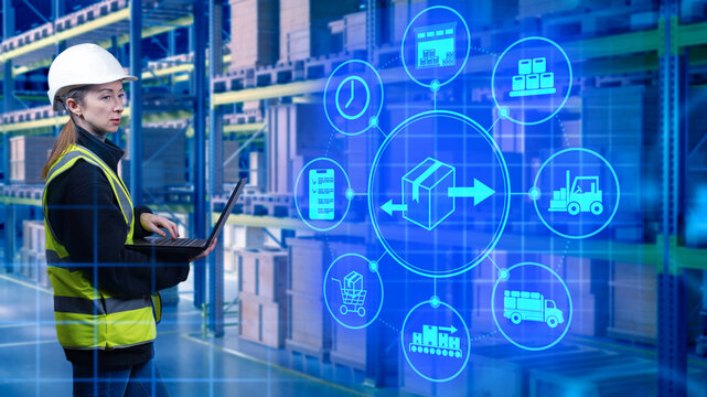 Digital supply chain specialist monitors warehouse processes with a laptop, coordinating inventory flow, transport planning and real-time logistics control.