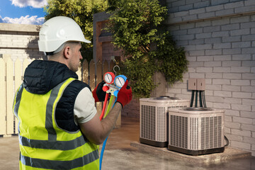 HVAC service technician tests residential air conditioning units with diagnostic gauges to check system pressure and ensure proper cooling performance.