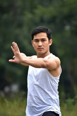 Man practicing martial arts in nature