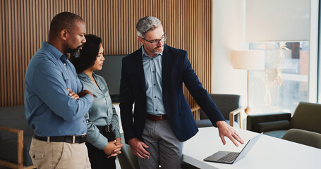 Laptop, meeting and business people in office with review, advice or feedback on legal project. Collaboration, tech and team of attorneys with planning, discussion and together for law case research