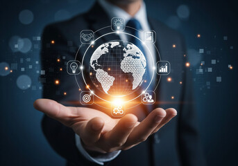 Businessman holding a digital globe with network icons representing global business connection and worldwide communication