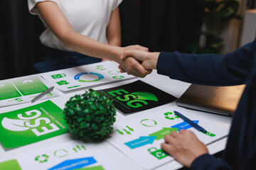Business people shaking hands discussing esg partnership agreement