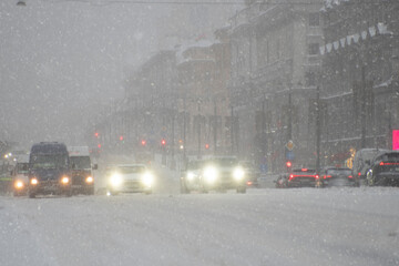 Cars on the road during a snowstorm.  winter.