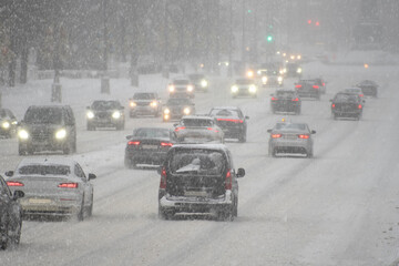 Cars on the road during a snowstorm.  winter.