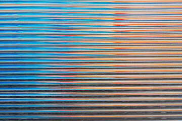 Abstract horizontal lines creating blue orange texture background