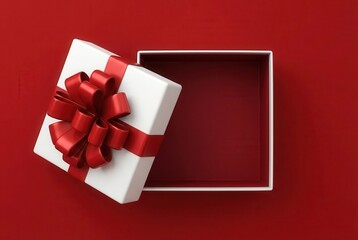 Elegant gift box with red bow on a vibrant red background