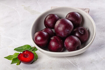 Raw ripe purple plum heap