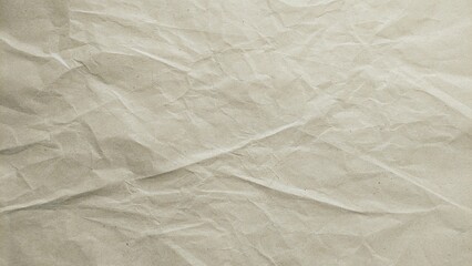 Obraz premium Crumpled cream paper texture background. Abstract recycled kraft paper surface. Vintage old paper backdrop with empty copy space.