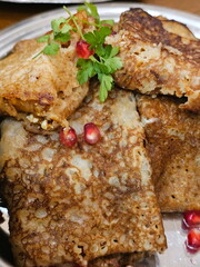 Pancakes with coffee on a wooden table