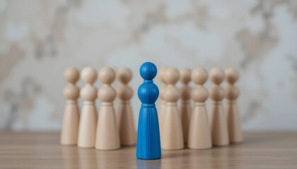 Unique leadership and talent recruitment concept with blue wooden figure standing out from a group for corporate human resources landing page