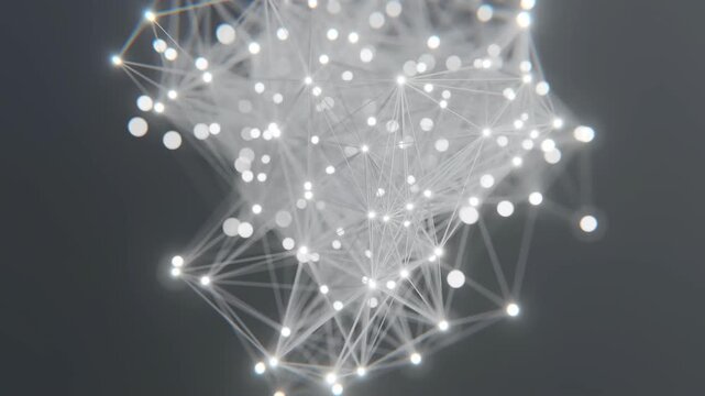High-angle close-up of a glowing white network connection map with nodes and lines on a dark background with a technological mood.