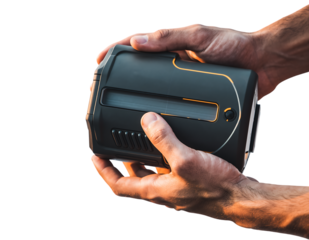 Masculine hands holding a sleek dark gray portable tech device with bright orange accent lines and a clear display,, isolated on white background