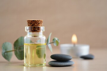 Serene spa setting with essential oil bottle and candles
