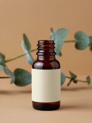 Amber glass bottle with blank label and eucalyptus leaves