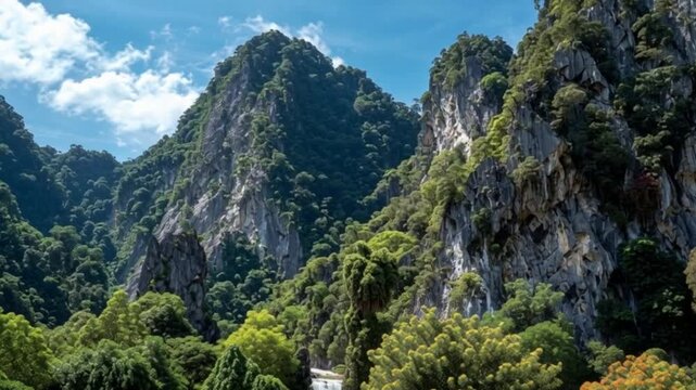 Beautiful Aerial Video of Limestone Mountains in Ipoh, Malaysia, Showcasing Lush Greenery, Towering Karst Cliffs, Tropical Trees, and a Serene Natural Landscape from Above in Perak Region Scenic