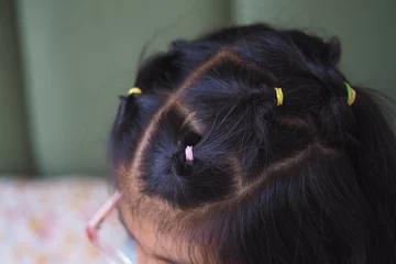 Gardinen Friseursalon Child with colorful hair ties in unique hairstyle  © Towfiqu Barbhuiya 