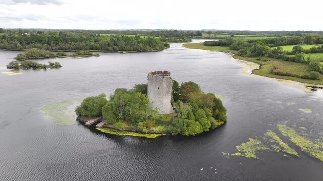 Castle tower on island in the lake Ireland. Cloughoughter Castle historical landmark, ruins.