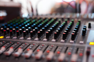 Professional Audio Mixing Console with Colorful Knobs and Sliders