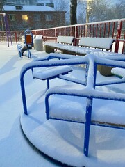 Obraz premium Children playground covered with snow