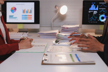 Business professionals analyzing financial data and reports