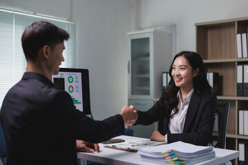 Business partners shaking hands making successful agreement