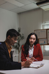 Business professionals collaborating on financial data in office meeting