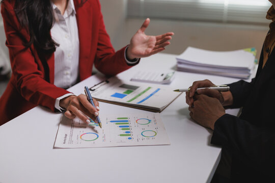 Business professionals analyzing financial data developing growth strategy - Powered by Adobe
