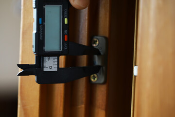 Digital Caliper Measuring Door Hinge for Precision Home Improvement and Accurate Measurements