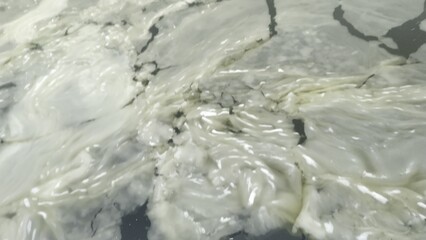 Abstract Texture of Slushy Melting Ice Floes and Cracks on Frozen Water Surface_2