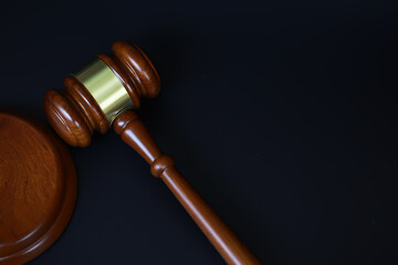 Gavel on Dark Surface Symbolizing Justice, Law, and Authority in Legal Settings