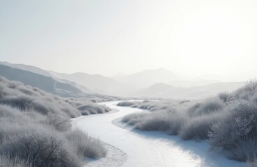Winding frozen river flows through snow covered valley with frosty grass. Misty mountains rise in background under bright hazy sky. Serene winter landscape invites peaceful exploration and travel.