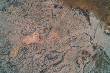 Abstract texture of eroded soil and dry ground with dendritic drainage patterns, concept of environmental disaster, Aerial drone top view