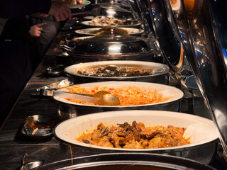 scooping the food, catering, dinner time