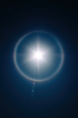Bright Sunlight with Dramatic Lens Flare in Deep Blue Sky